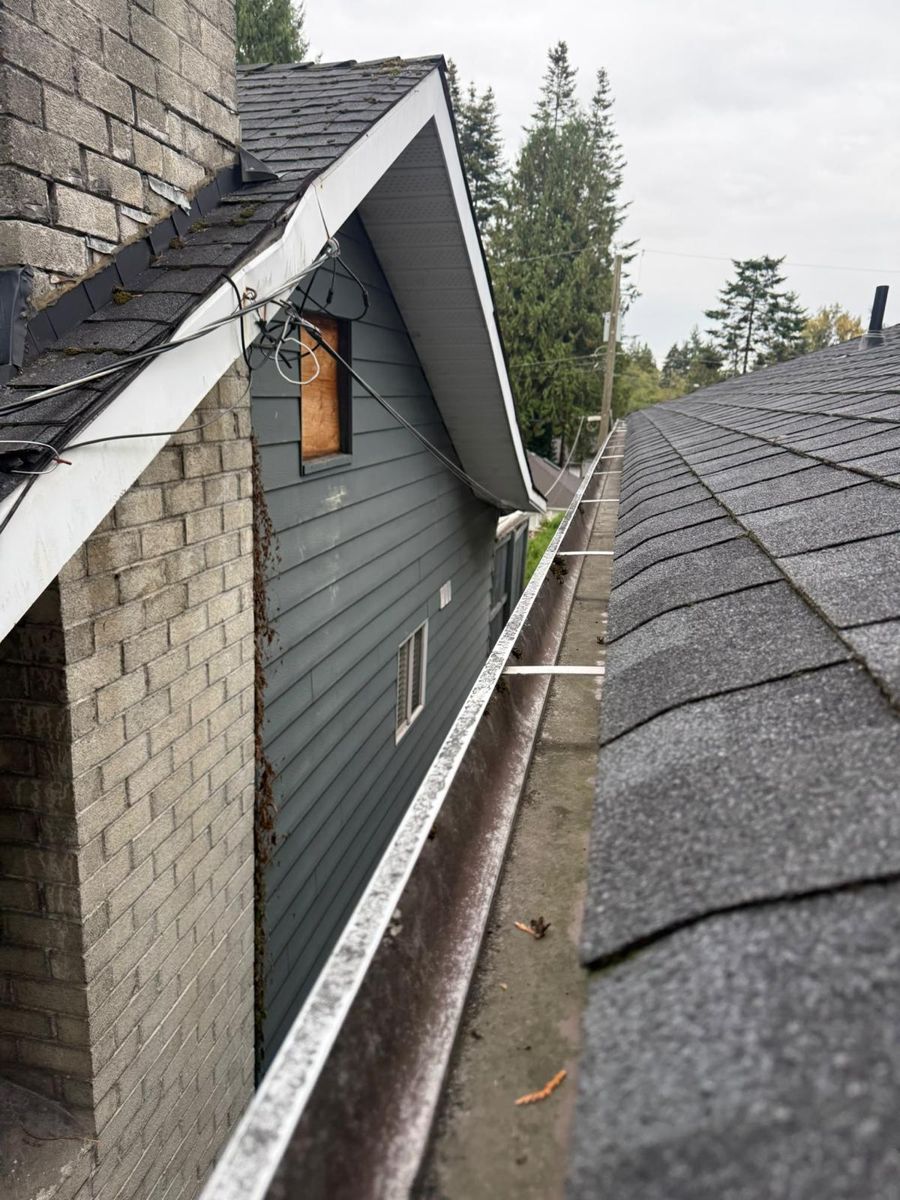 Cleared gutter running along a roofline